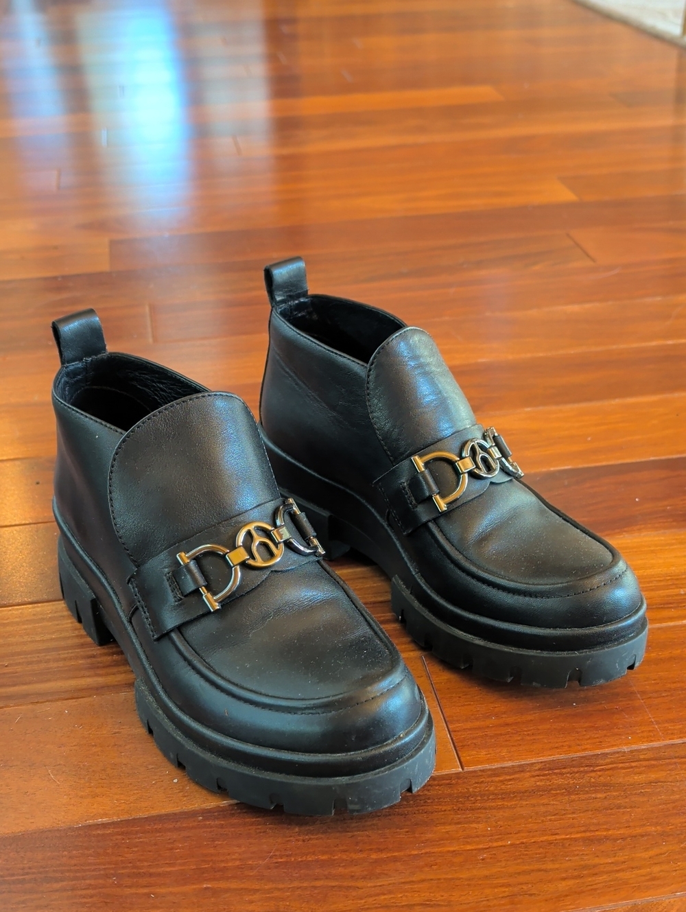 Women's Black Leather Lug Sole Loafers with Gold Hardware